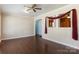 The living room features hardwood floors, a ceiling fan, and a picture window to the dining room at 602 Charles Rd, Shelby, NC 28152