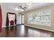 The living room features hardwood floors, a ceiling fan, and ample natural light at 602 Charles Rd, Shelby, NC 28152