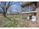 Spacious backyard featuring a screened porch, mature trees, and ample space for outdoor activities and entertainment at 607 Dick St, Albemarle, NC 28001