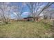 Large, grassy backyard with mature trees, providing ample space for outdoor activities and relaxation at 607 Dick St, Albemarle, NC 28001