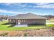 Spacious backyard with a concrete patio, offering a private outdoor retreat next to the charming brick home at 609 Rosemore Pl, Rock Hill, SC 29732