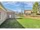 A spacious backyard with lush green grass and mature trees at 609 Rosemore Pl, Rock Hill, SC 29732