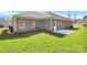 A well-maintained backyard with lush green grass and brick house at 609 Rosemore Pl, Rock Hill, SC 29732