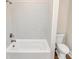 Bright bathroom with a white tiled shower, a built-in tub, and a low flow toilet at 609 Rosemore Pl, Rock Hill, SC 29732