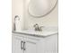 Bathroom vanity features a white cabinet, brushed nickel hardware, and marble countertop at 609 Rosemore Pl, Rock Hill, SC 29732