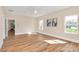 Bright bedroom featuring hardwood floors, neutral walls, and large windows at 609 Rosemore Pl, Rock Hill, SC 29732