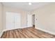 Bedroom offers natural light, wood floors, and closet space at 609 Rosemore Pl, Rock Hill, SC 29732
