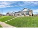 Exterior view of a brick home with manicured lawn and inviting entrance in a peaceful neighborhood at 609 Rosemore Pl, Rock Hill, SC 29732