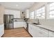 Kitchen featuring white cabinets, granite countertops, and stainless steel appliances at 609 Rosemore Pl, Rock Hill, SC 29732