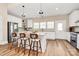 Bright kitchen featuring white cabinets, granite countertops, and a stainless steel refrigerator at 609 Rosemore Pl, Rock Hill, SC 29732