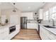 Kitchen with white cabinets, granite countertops, stainless steel appliances, and wood flooring at 609 Rosemore Pl, Rock Hill, SC 29732