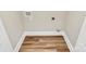 Bright laundry room featuring wood-look flooring and hookups for modern appliances at 609 Rosemore Pl, Rock Hill, SC 29732