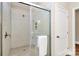 Modern shower features gray tile, glass doors, showerhead, and convenient towel bar at 609 Rosemore Pl, Rock Hill, SC 29732