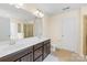 A spacious bathroom featuring double sinks, a private toilet, and a glass shower at 6126 Castlecove Rd, Charlotte, NC 28278