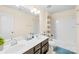 Well-lit bathroom features double sinks, a tub, and a shower for ultimate comfort and convenience at 6126 Castlecove Rd, Charlotte, NC 28278