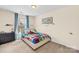 Comfortable bedroom with colorful bedding, ample natural light, and decor at 6126 Castlecove Rd, Charlotte, NC 28278