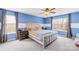 A primary bedroom featuring a queen bed, dual nightstands, and two windows at 6126 Castlecove Rd, Charlotte, NC 28278
