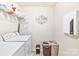 Convenient laundry room featuring modern appliances and ample space for sorting and folding laundry at 6126 Castlecove Rd, Charlotte, NC 28278