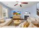 Inviting living room with neutral decor, a fireplace, and a large television, perfect for relaxation and entertainment at 6126 Castlecove Rd, Charlotte, NC 28278