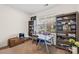 Bright home office with a large window, built-in shelving, and a neutral color scheme for a productive workspace at 6126 Castlecove Rd, Charlotte, NC 28278