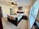 Bedroom with carpet flooring, window, and ceiling fan at 719 Mountain Quail Dr # 34, Charlotte, NC 28216