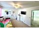 Cozy bedroom featuring a ceiling fan, mounted television and natural light at 719 Mountain Quail Dr # 34, Charlotte, NC 28216