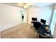 Neutral bedroom with a ceiling fan, natural light, and versatile space for a home office setup at 719 Mountain Quail Dr # 34, Charlotte, NC 28216