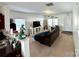 Inviting living room with carpet flooring, ample natural light, and comfortable seating at 719 Mountain Quail Dr # 34, Charlotte, NC 28216