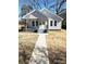 Charming home with craftsman style porch, painted brick accents, and sidewalk at 723 S Confederate Ave, Rock Hill, SC 29730