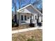 Charming single story home featuring detailed front porch and painted brick accents at 723 S Confederate Ave, Rock Hill, SC 29730