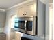 Built-in microwave and gray cabinets enhance this modern kitchen at 723 S Confederate Ave, Rock Hill, SC 29730