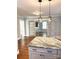 Kitchen featuring gray cabinets, granite countertops, stainless steel appliances, and hardwood floors at 723 S Confederate Ave, Rock Hill, SC 29730