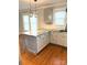Kitchen island with granite countertops and white cabinets provides ample storage at 723 S Confederate Ave, Rock Hill, SC 29730