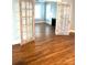 Open living room featuring gleaming hardwood floors and glass french doors at 723 S Confederate Ave, Rock Hill, SC 29730