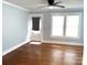 Bright living room featuring hardwood floors, fan, and many windows at 723 S Confederate Ave, Rock Hill, SC 29730