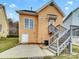 View of the backyard with a small deck and stairs to an upper level door at 7400 Gilead Rd, Huntersville, NC 28078
