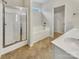 Bright bathroom featuring a soaking tub, separate shower, and double sinks at 7400 Gilead Rd, Huntersville, NC 28078