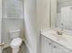This bathroom features modern fixtures, a spacious vanity and a large mirror at 7400 Gilead Rd, Huntersville, NC 28078