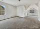 Large bedroom with carpet flooring, an attic ceiling, and large windows at 7400 Gilead Rd, Huntersville, NC 28078