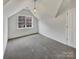 Bedroom features a large window, neutral walls, and an overhead light at 7400 Gilead Rd, Huntersville, NC 28078