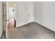 Neutral bedroom features carpet, natural light and a large closet for optimal storage space at 7400 Gilead Rd, Huntersville, NC 28078