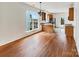 Open floor plan with dining room featuring hardwood floors next to the kitchen at 7400 Gilead Rd, Huntersville, NC 28078
