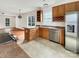 Open kitchen boasts stainless steel appliances, ample counter space, and a center island at 7400 Gilead Rd, Huntersville, NC 28078