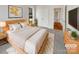 Bright bedroom with a large bed, natural light, and ensuite at 7400 Gilead Rd, Huntersville, NC 28078