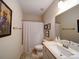 Well-lit bathroom with a shower/tub combo, tile flooring, and neutral walls at 7504 Canova Ln # 5, Charlotte, NC 28278