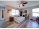 Bright bedroom with a large daybed, natural light, and wood-look flooring at 7504 Canova Ln # 5, Charlotte, NC 28278