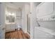 Full bathroom with vanity, shower, and stacked washer/dryer at 8629 Coralbell Ln, Charlotte, NC 28213