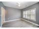 Spacious bedroom features neutral paint and a large window at 8629 Coralbell Ln, Charlotte, NC 28213