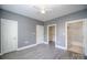 Bedroom with ample closet space and an en-suite bathroom at 8629 Coralbell Ln, Charlotte, NC 28213