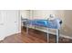 A well-lit bedroom with hardwood floors, a bed, and a closet at 8923 Meadow Vista Rd, Charlotte, NC 28213